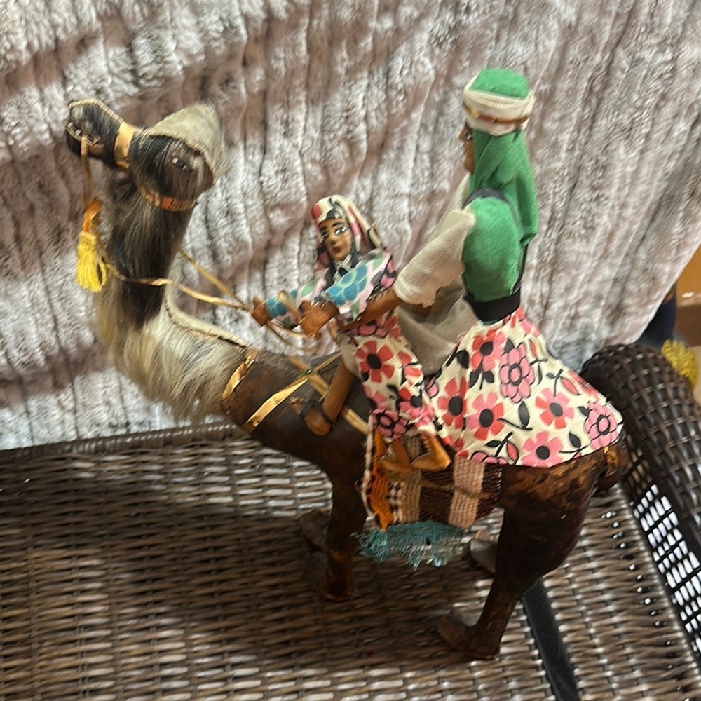 Hand crafted leather camel and two riders 19” x 16”